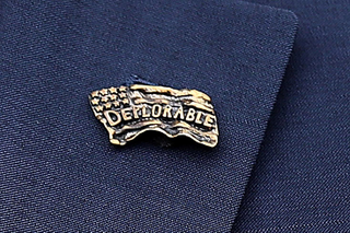Illustration for article titled Donald Trump Jr. Wore a ‘Deplorable’ Lapel Pin Because He’s a Jackass